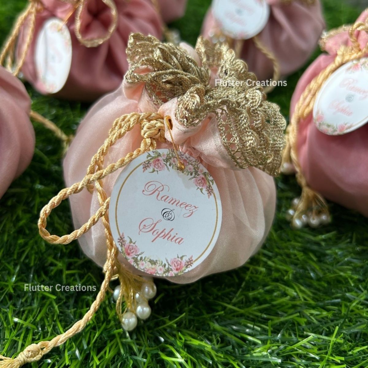 Pastel Pink Organza potlis with Double Pearl tassel and name tag