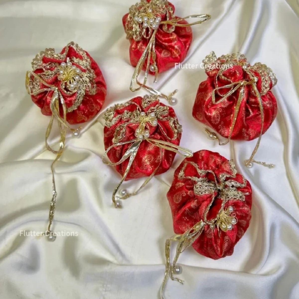Jamawar potlis bags with pearl tassel