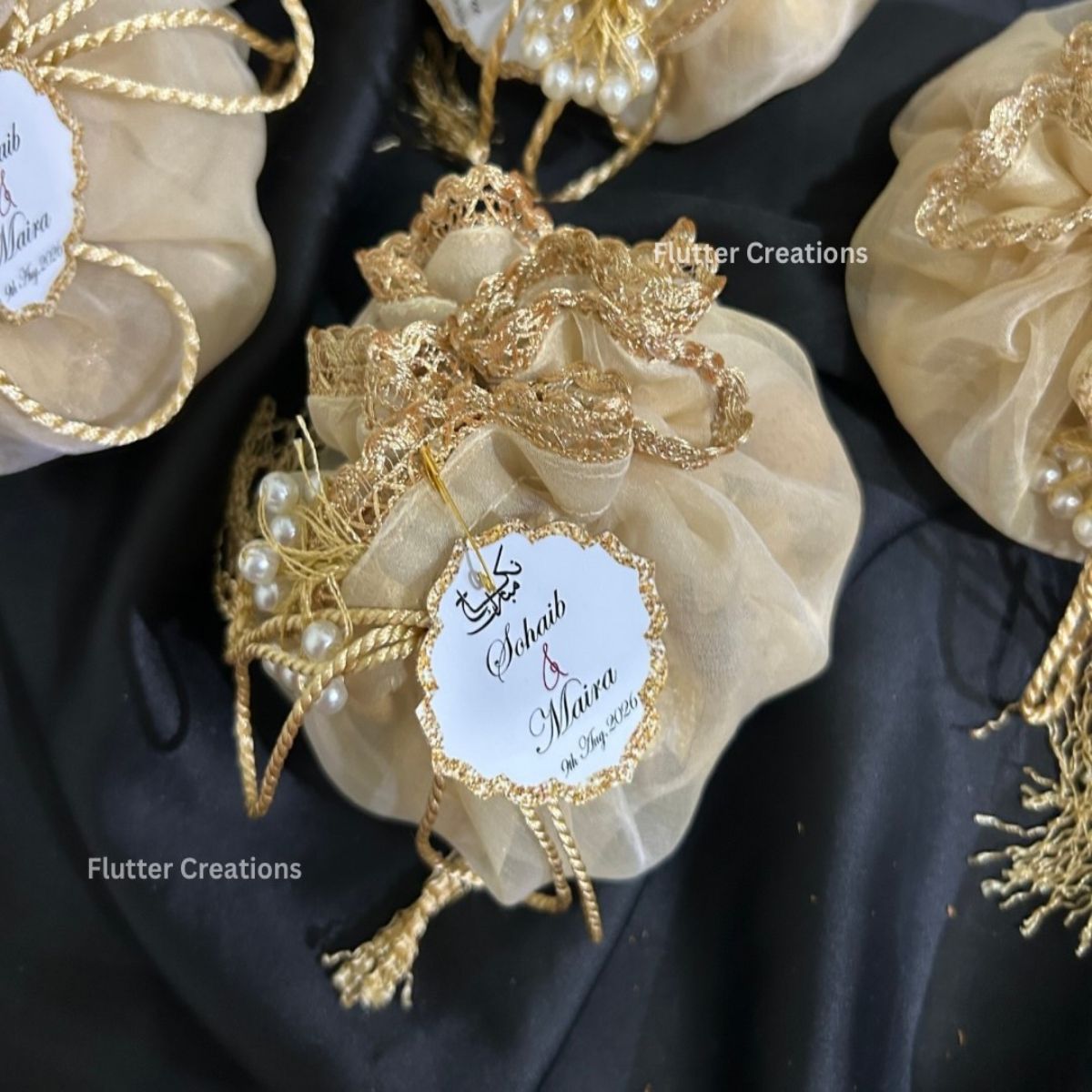 Beige Organza Potlis with single pearl tassel and name tag