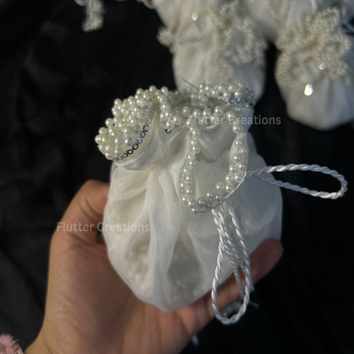 White Organza potlis/pouches with pearl lace