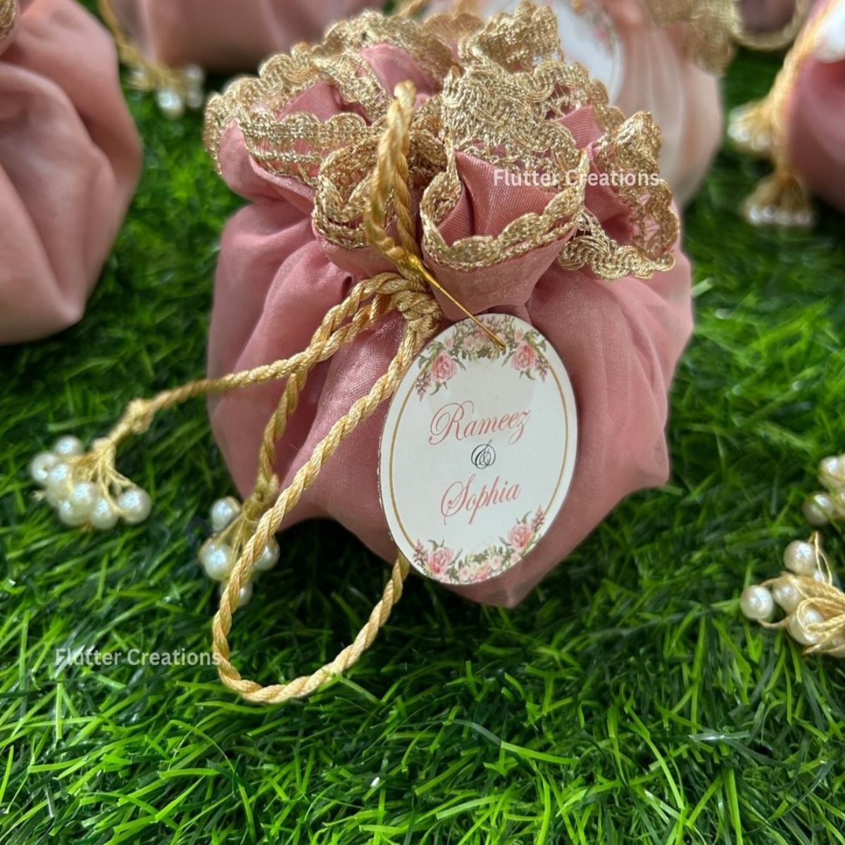 Pastel Pink Organza potlis with Double Pearl tassel and name tag