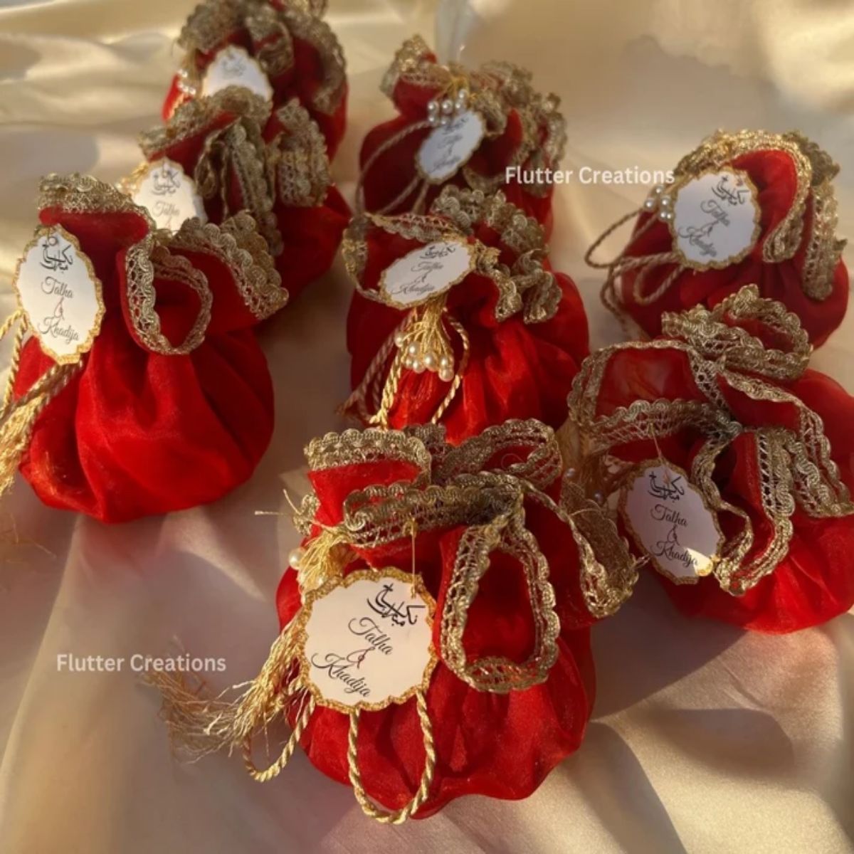 Red Organza potlis with pearl tassel and tag