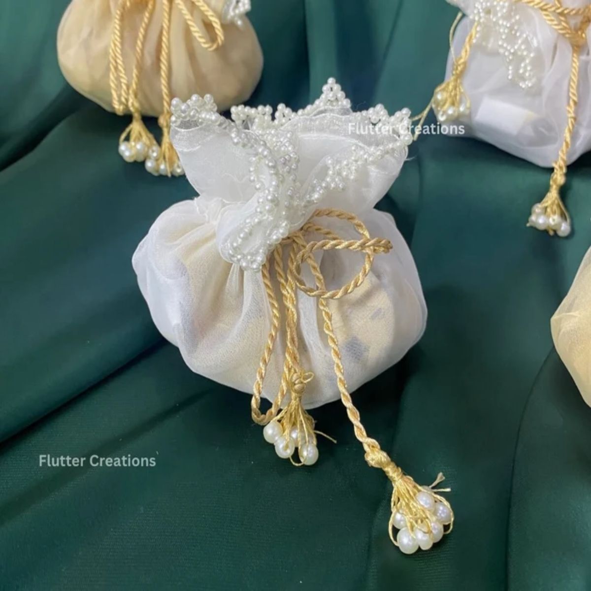 Golden & White Organza potlis/pouches with pearl lace and tassel
