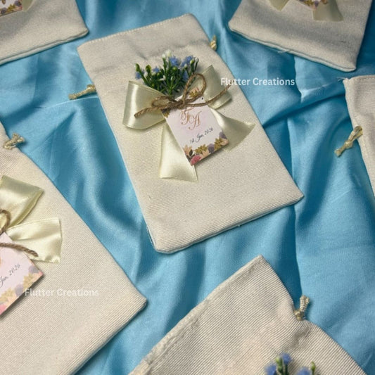 Premium White Pouches/potlis with Blue Baby's breath