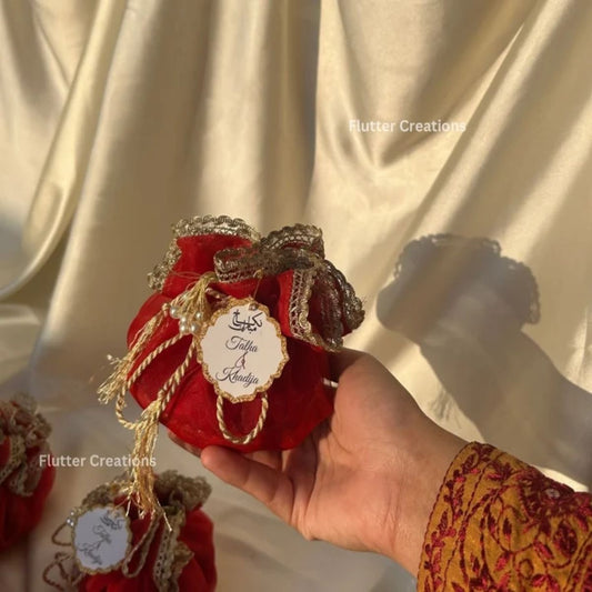Red Organza potlis with pearl tassel and tag